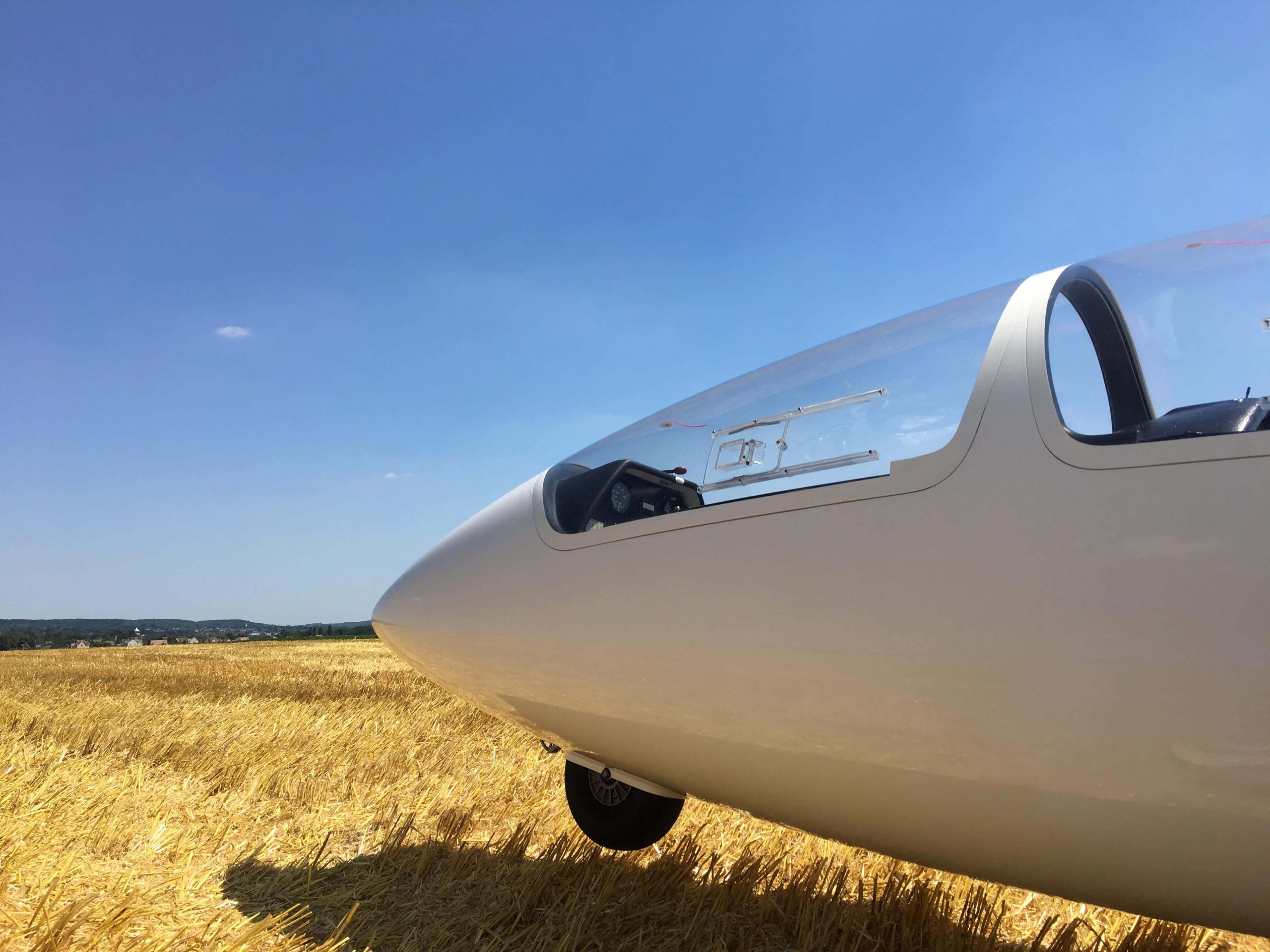 Glider landing on a field